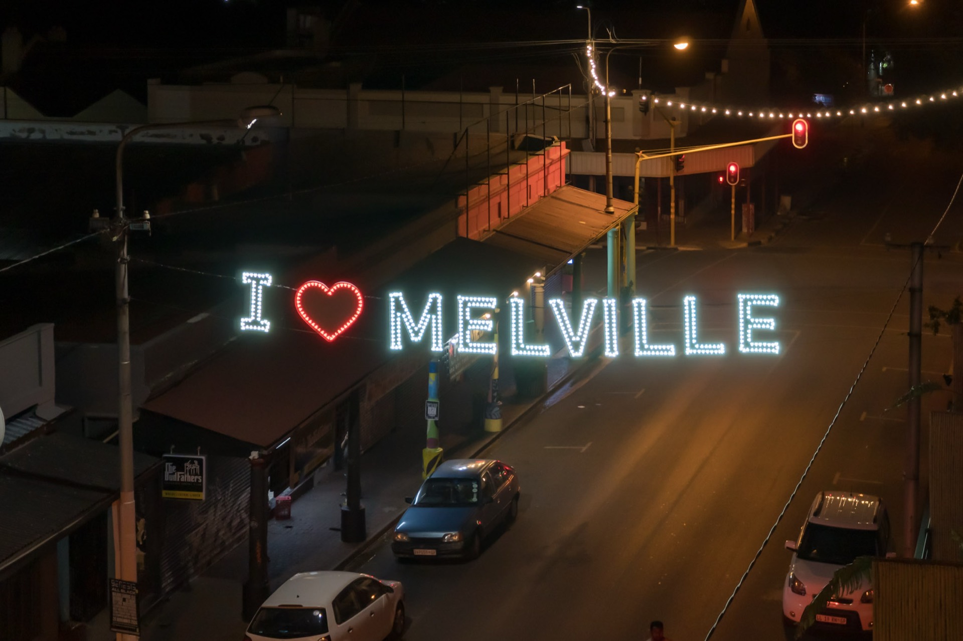 The I ❤ Melville lights over 7th Street at night